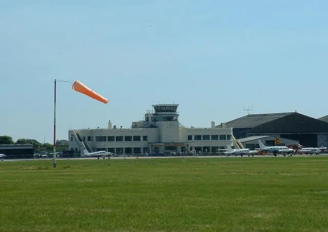 Shoreham Airport terminal building and windsock