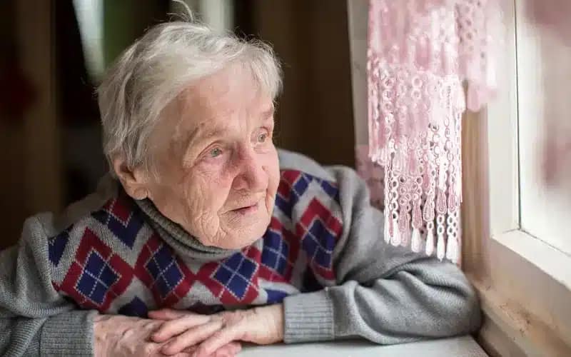 Lonely older lady waiting for Aurora Home Care in Worthing to visit